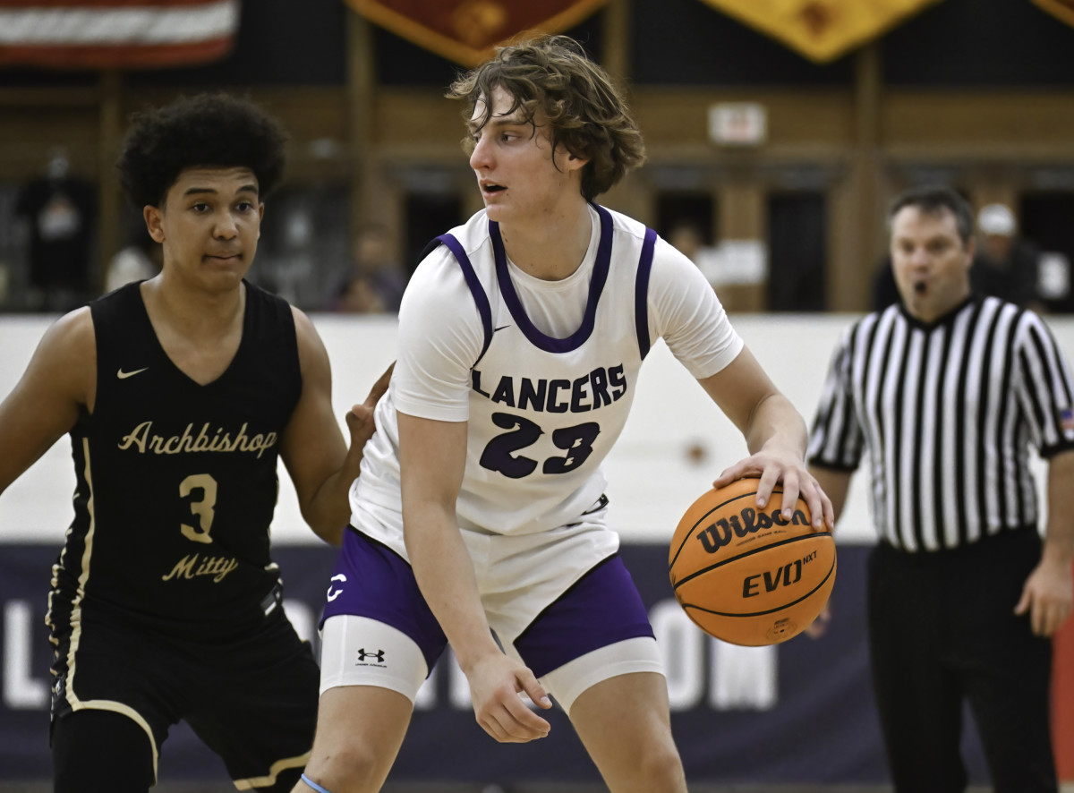Jake Hall backs down Mitty leading scorer Tyler Jones.